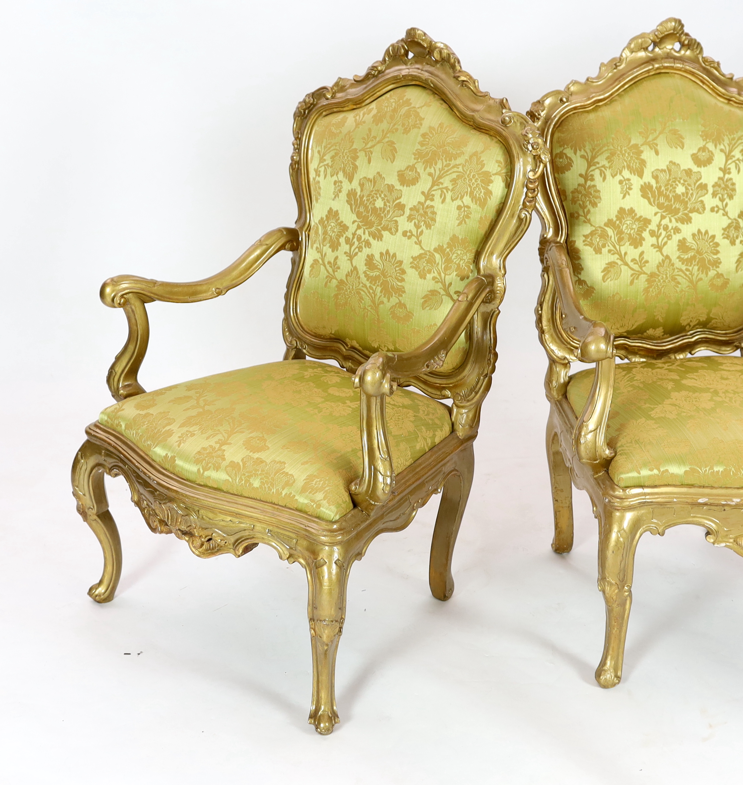 A set of six 18th century Venetian carved giltwood open armchairs, 80cm wide, 68cm deep, 122cm high, Please note this lot attracts an additional import tax of 5% on the hammer price